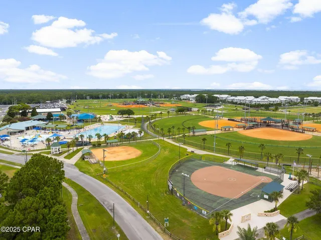an aerial view of a house with a swimming pool