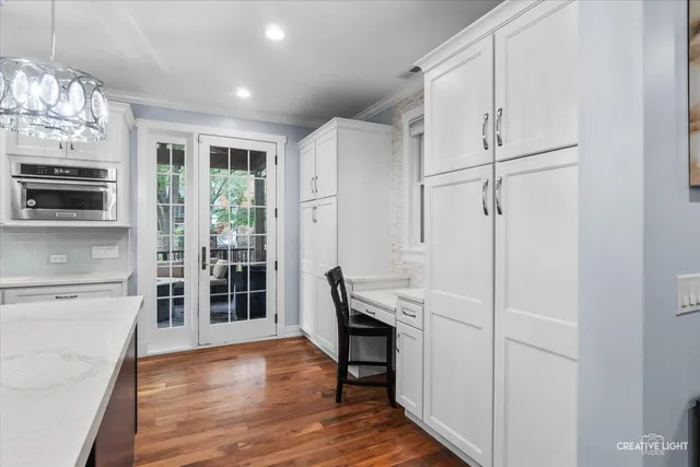 a view of kitchen with furniture and wooden floor
