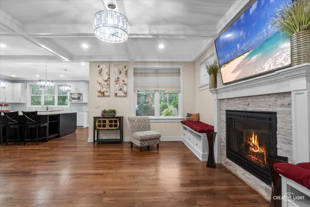 a living room with furniture fireplace and window