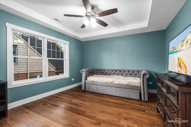 a bedroom with bed and a window