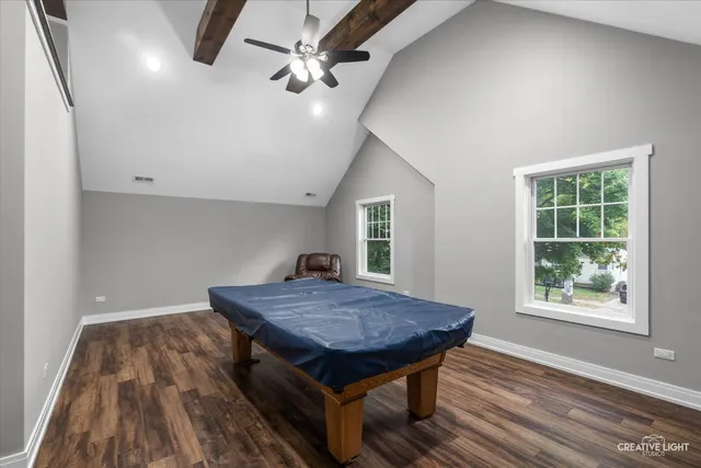 an outdoor space with wooden floor