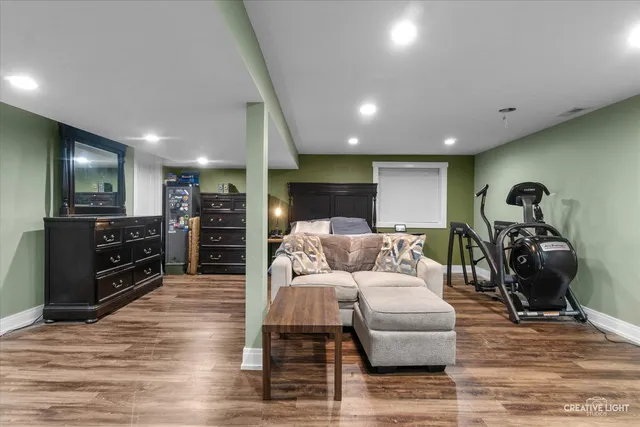 a living room with furniture a couch and a flat screen tv