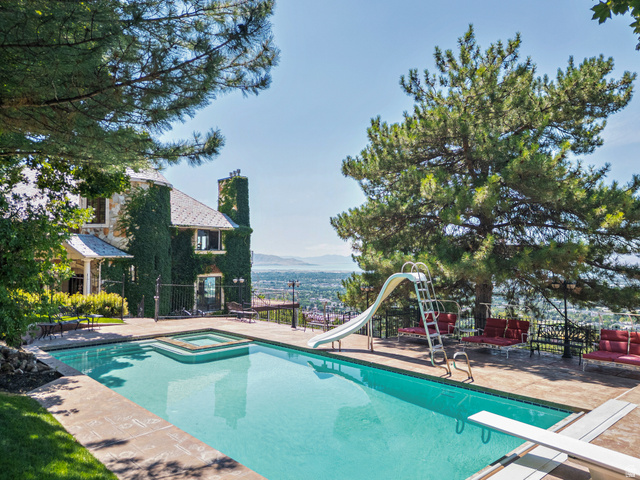 4093 North Imperial Way Provo, UT 84604 - Photo 78 of 96 Outdoor swimming pool featuring an integrated spa, diving board, and a water slide