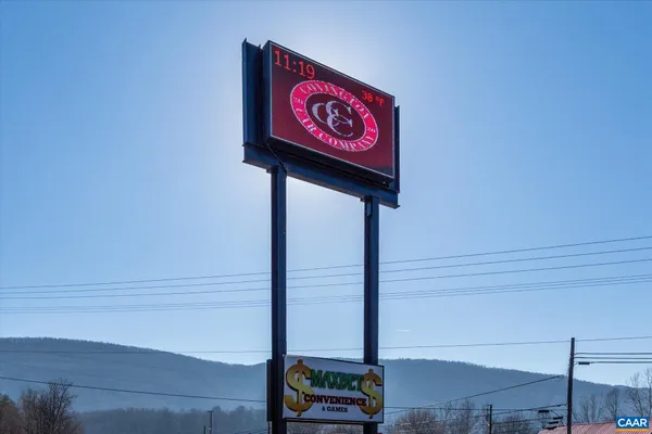 a view of an entryway with a table and chairs