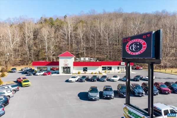 a grocery store filled with lots of traffic and tall buildings