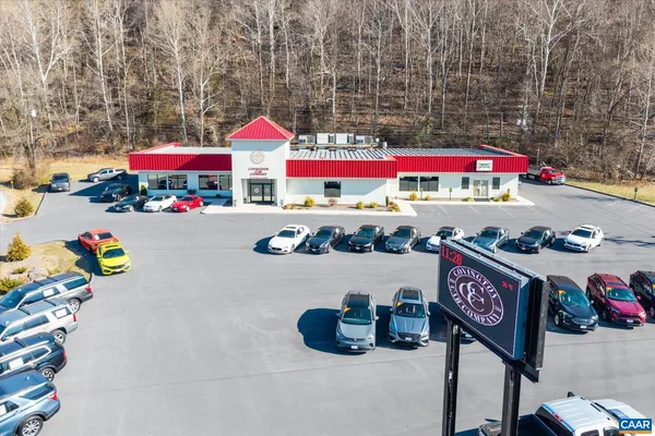 an aerial view of residential houses and trees