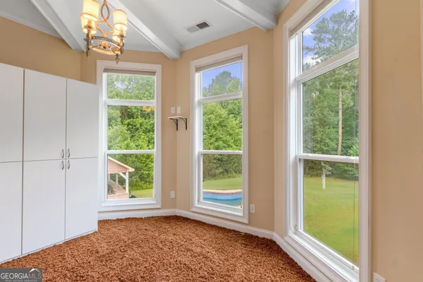 a view of staircase with a large window