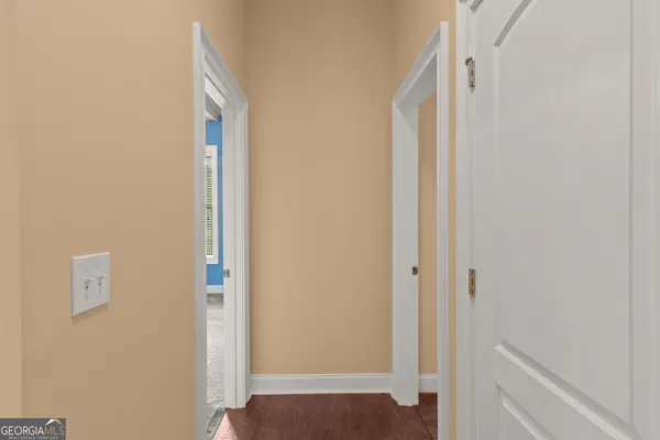 a view of a house with a yard and pathway