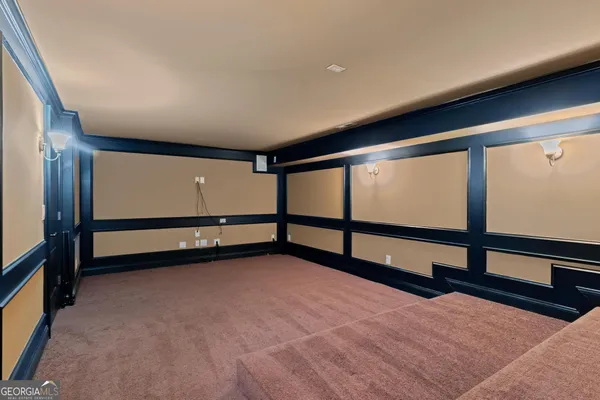 a kitchen with stainless steel appliances kitchen island granite countertop a stove a sink and a refrigerator