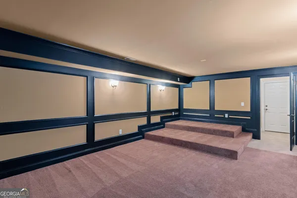 a kitchen with stainless steel appliances granite countertop a stove and cabinets