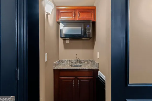 a view of a balcony with furniture