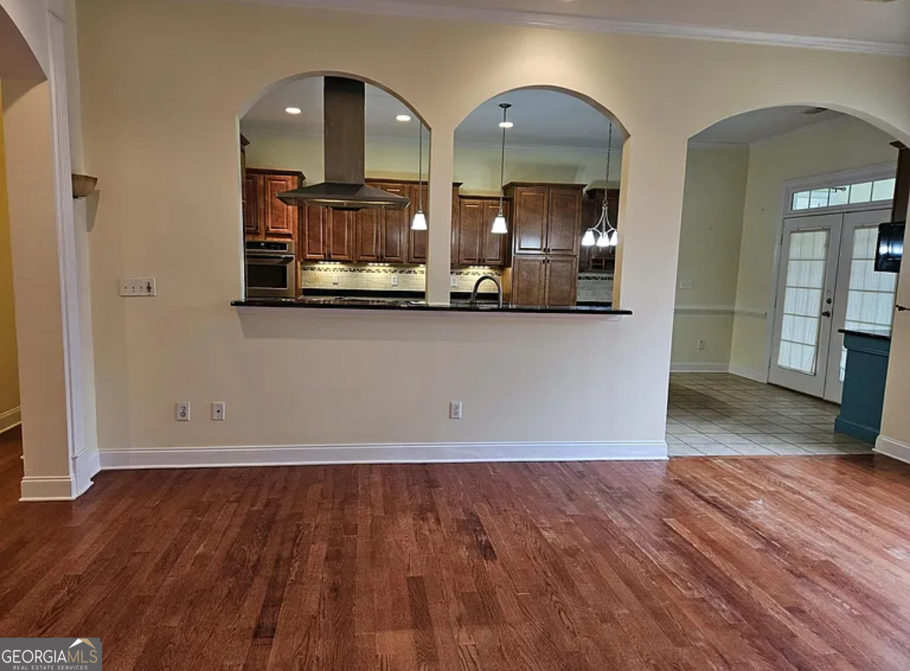 968 Mill Road McDonough, GA 30253 - Photo 49 of 77 wooden floor in kitchen with a mirror
