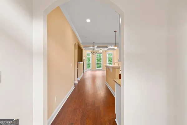 a view of hallway with wooden floor
