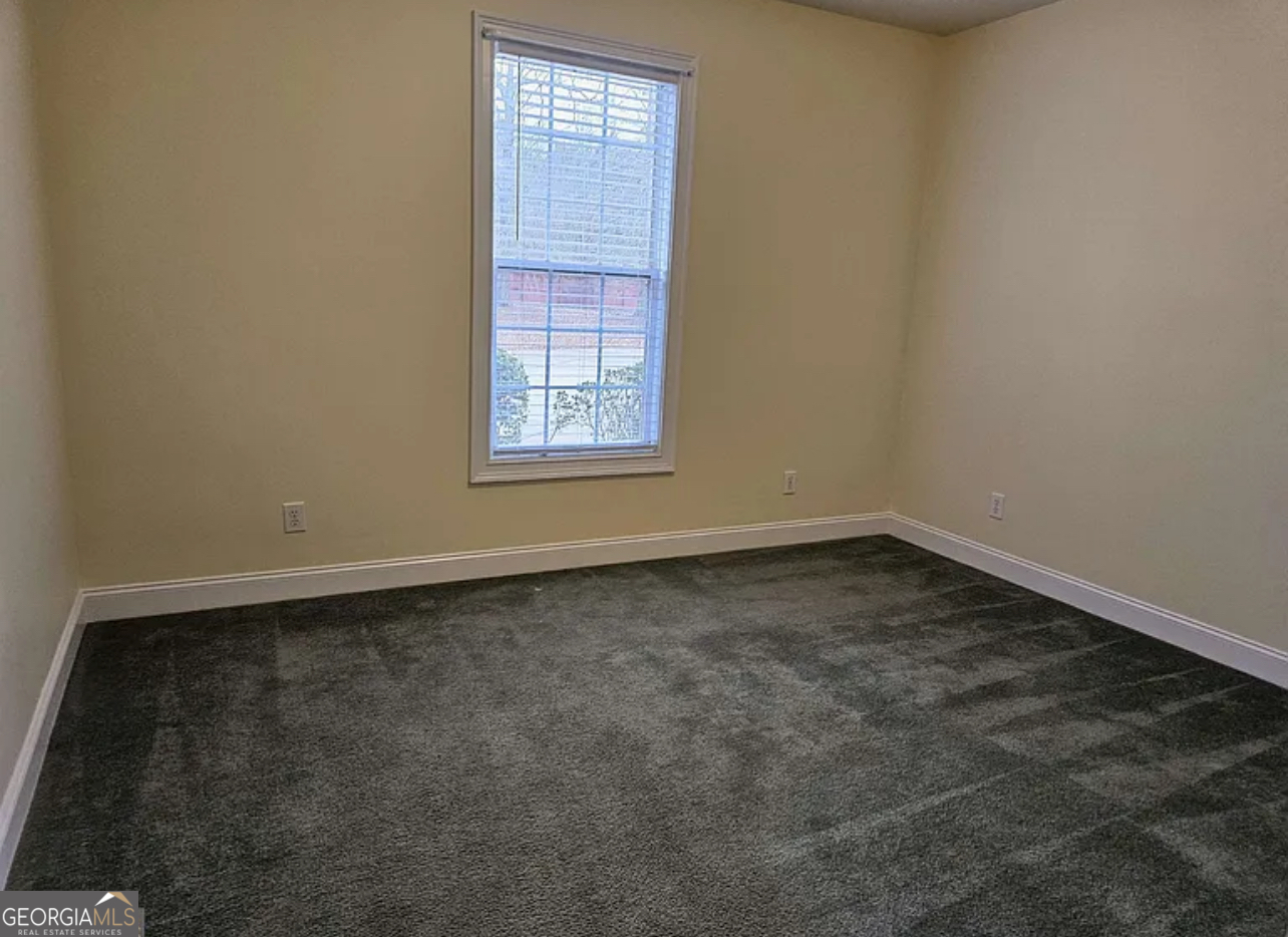 968 Mill Road McDonough, GA 30253 - Photo 62 of 77 an empty room with a window