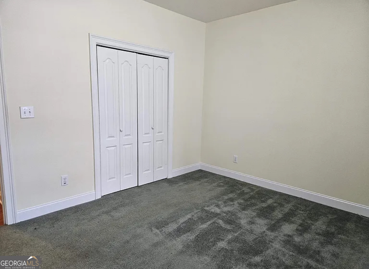 968 Mill Road McDonough, GA 30253 - Photo 63 of 77 an empty room with closet area