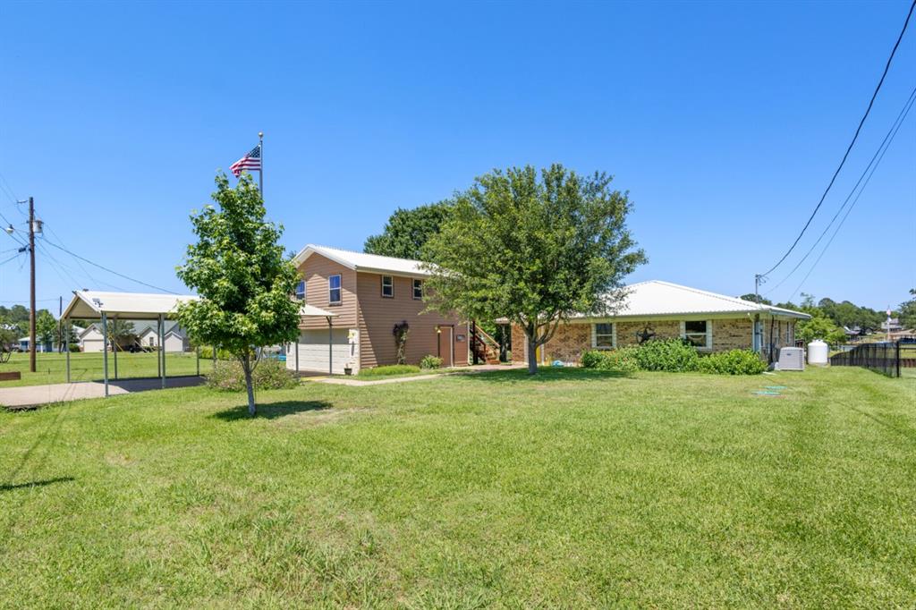 227 Scenic Road Trinidad, TX 75163 - Photo 5 of 40 a house with garden in front of it