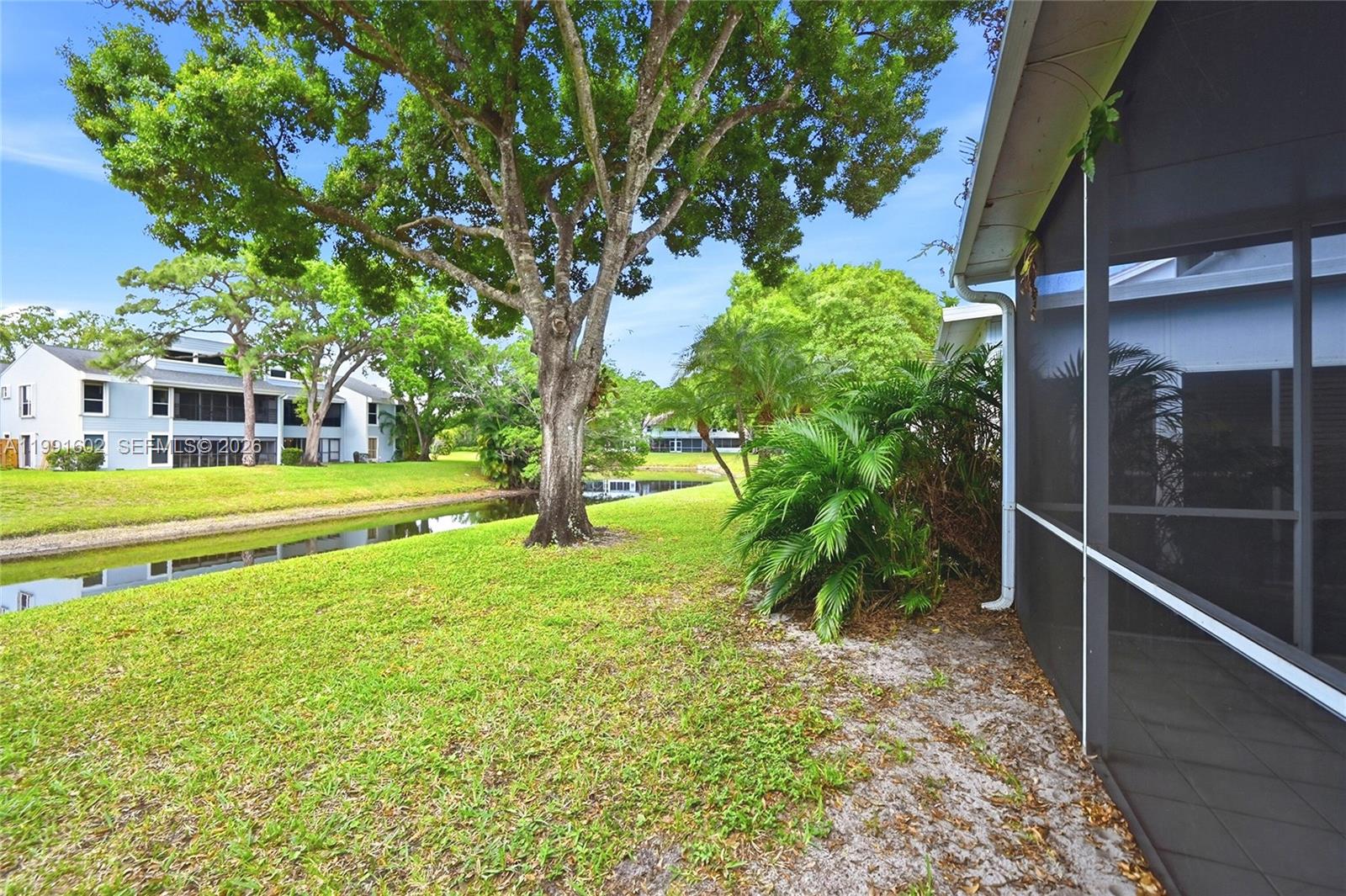 6215 Old Court Road, Unit 505 Boca Raton, FL 33433 - Photo 33 of 36 a view of a yard with plants and large trees