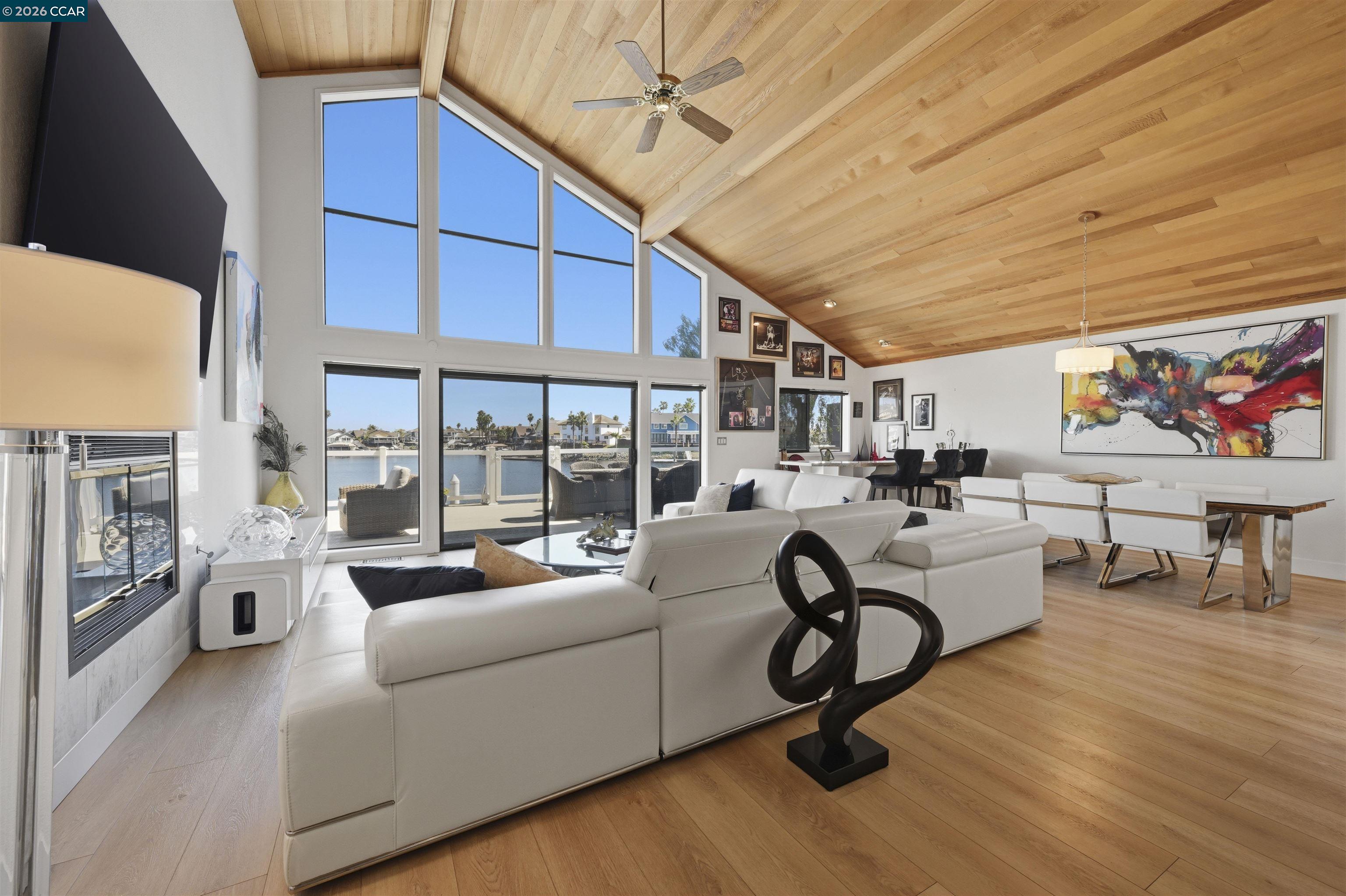 2027 Windward Point Discovery Bay, CA 94505 - Photo 16 of 53 a living room with furniture gym equipment and a large window