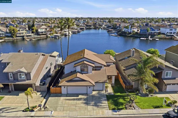 an aerial view of a house with a ocean view