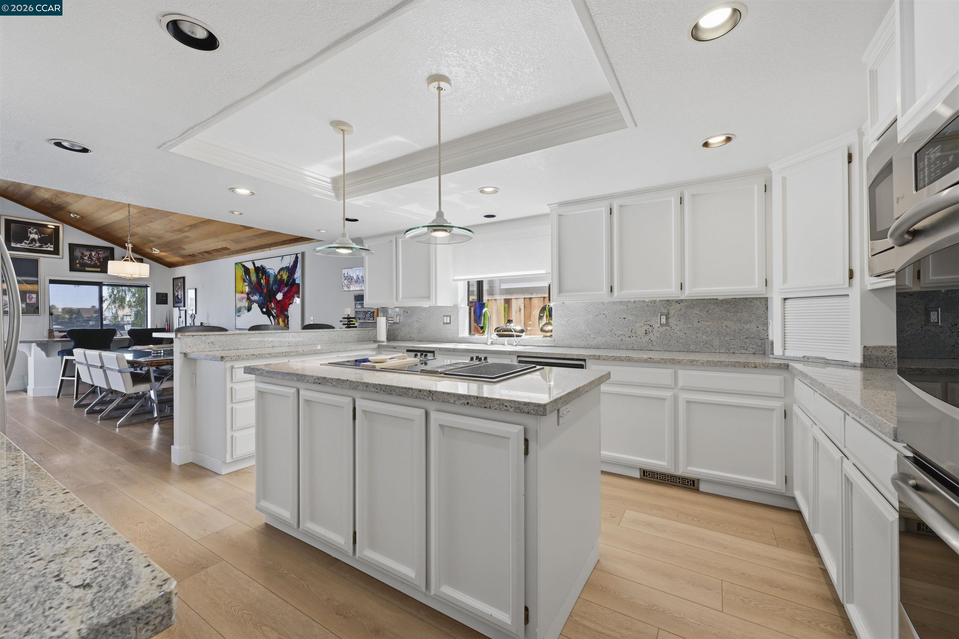 2027 Windward Point Discovery Bay, CA 94505 - Photo 24 of 53 a kitchen with stainless steel appliances granite countertop a sink and cabinets