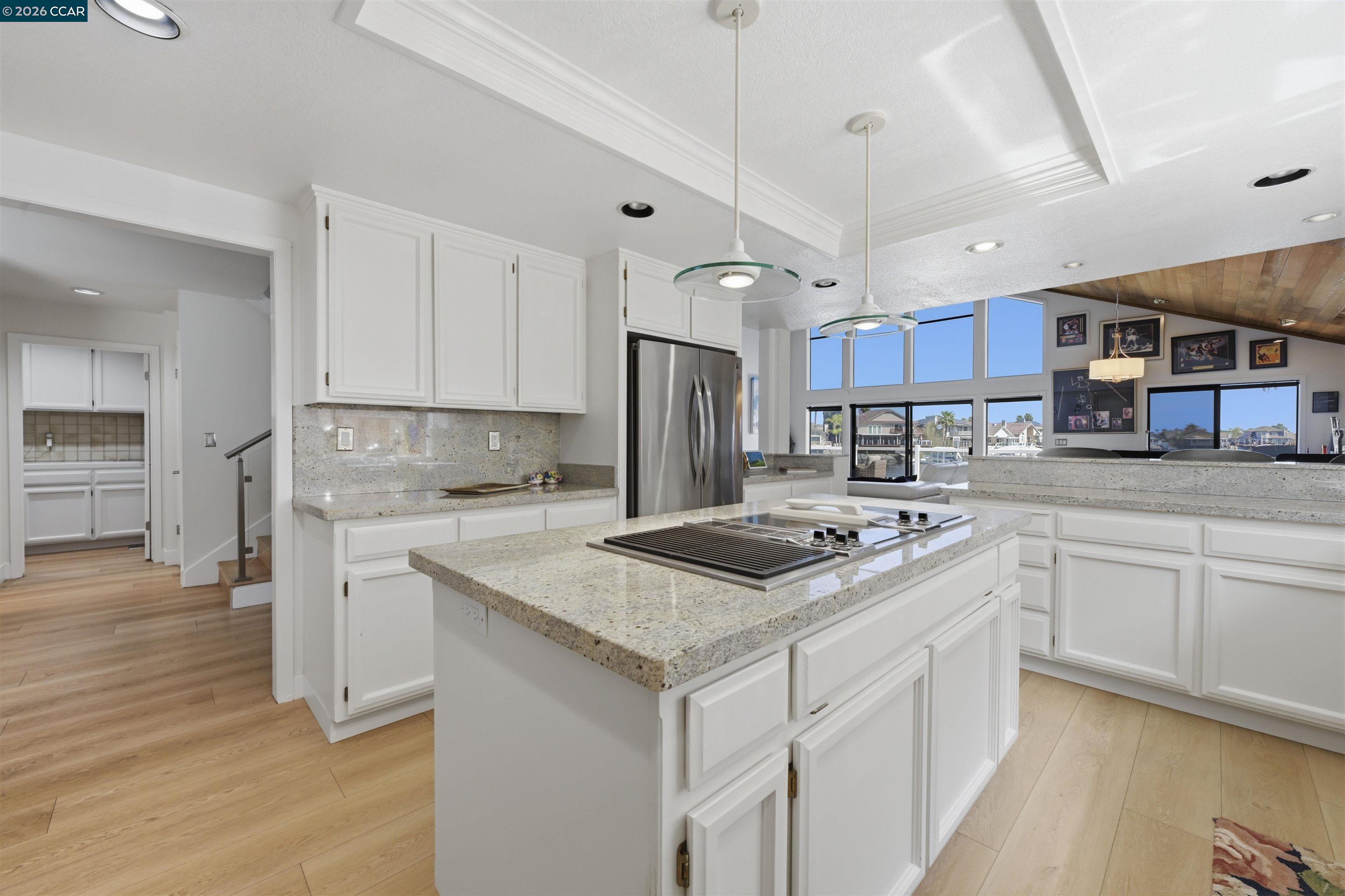 2027 Windward Point Discovery Bay, CA 94505 - Photo 25 of 53 a kitchen with stainless steel appliances granite countertop a stove refrigerator sink and cabinets
