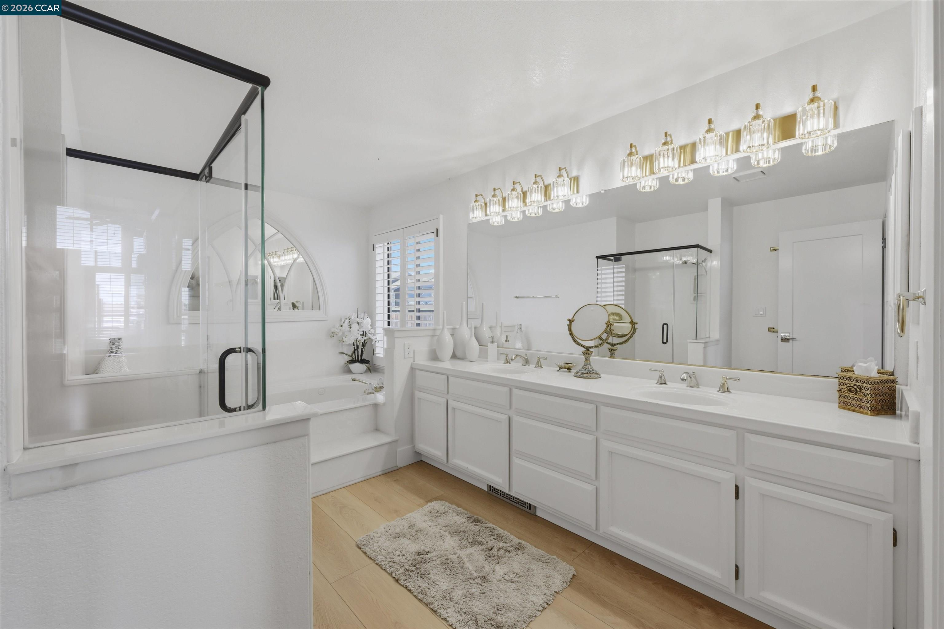 2027 Windward Point Discovery Bay, CA 94505 - Photo 29 of 53 a bathroom with a double vanity sink mirror double and shower