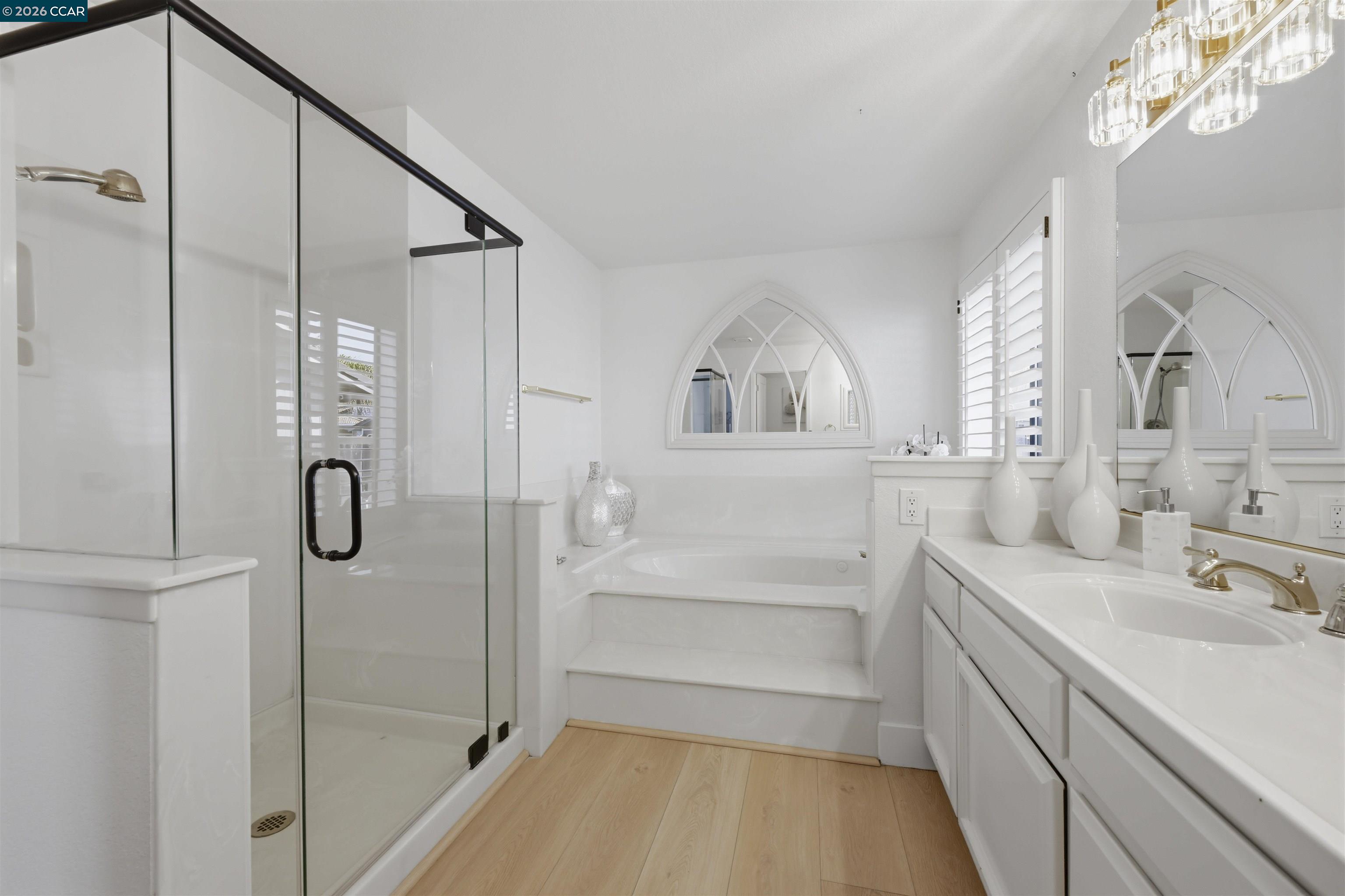 2027 Windward Point Discovery Bay, CA 94505 - Photo 30 of 53 a bathroom with a sink a mirror and shower
