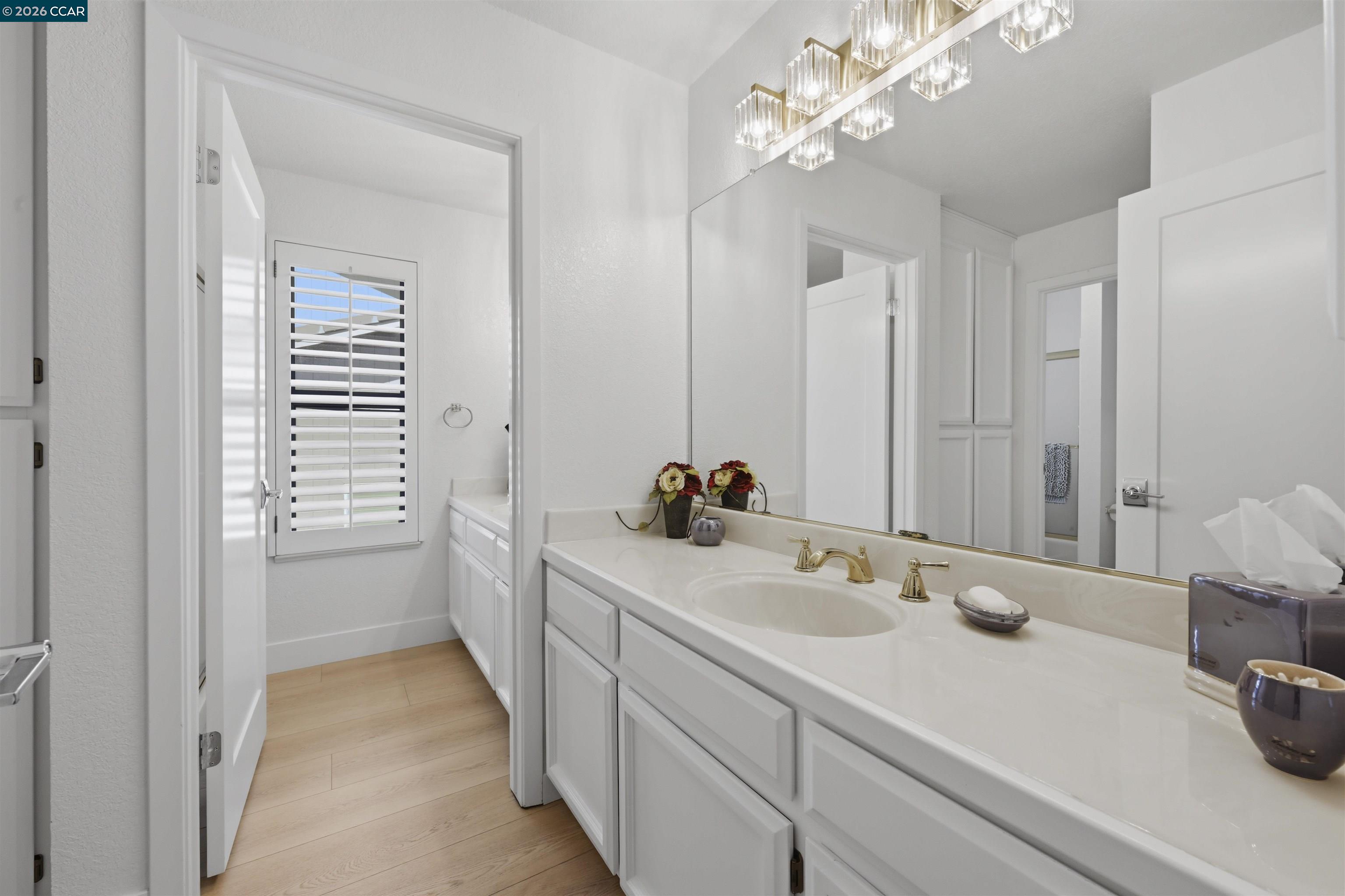 2027 Windward Point Discovery Bay, CA 94505 - Photo 36 of 53 a bathroom with a sink double vanity and a mirror