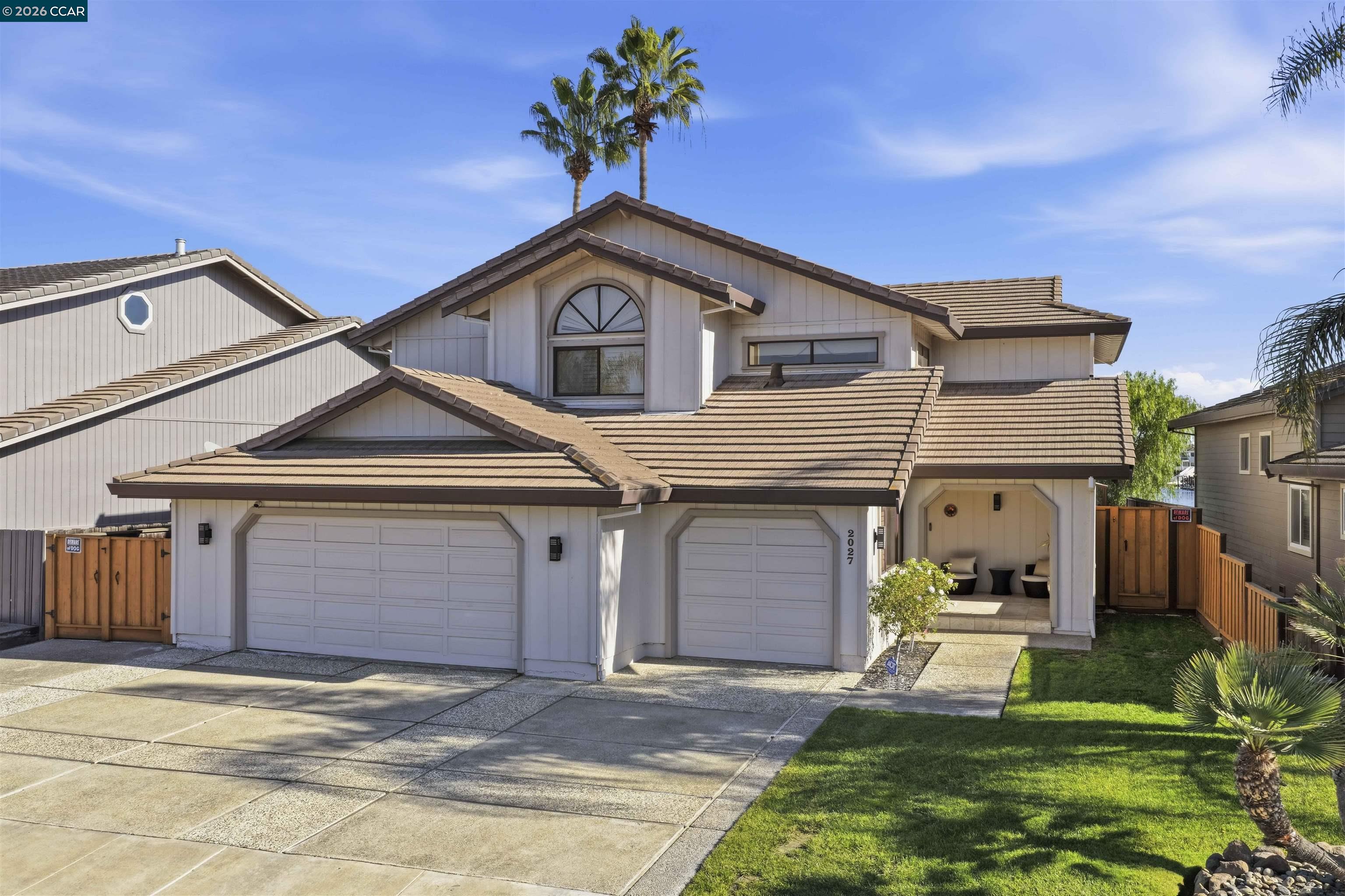 2027 Windward Point Discovery Bay, CA 94505 - Photo 9 of 53 a front view of a house with a yard