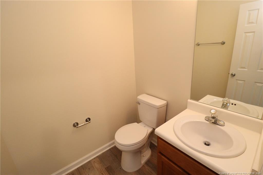2936 Filbert Street Raleigh, NC 27610 - Photo 12 of 27 a bathroom with a sink and a toilet