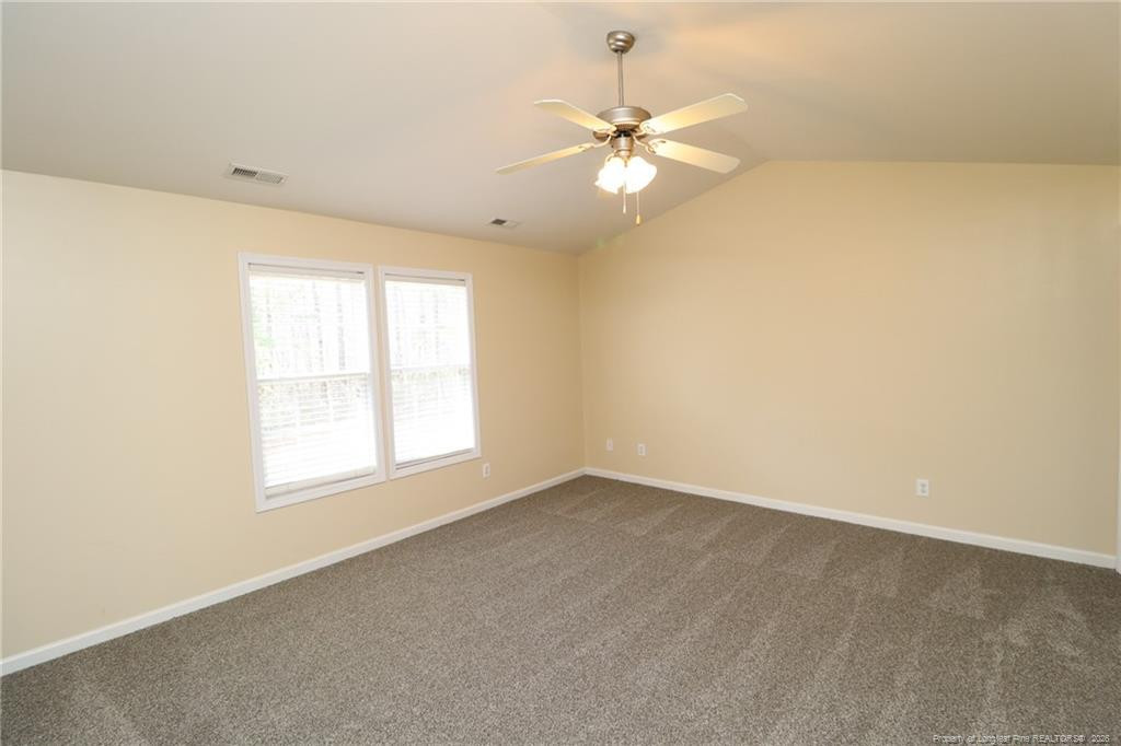 2936 Filbert Street Raleigh, NC 27610 - Photo 13 of 27 an empty room with a window and a fan