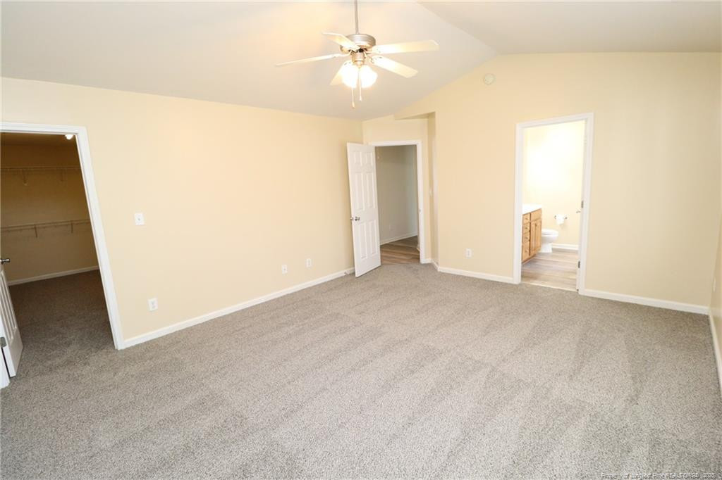 2936 Filbert Street Raleigh, NC 27610 - Photo 16 of 27 an empty room with chandelier fan