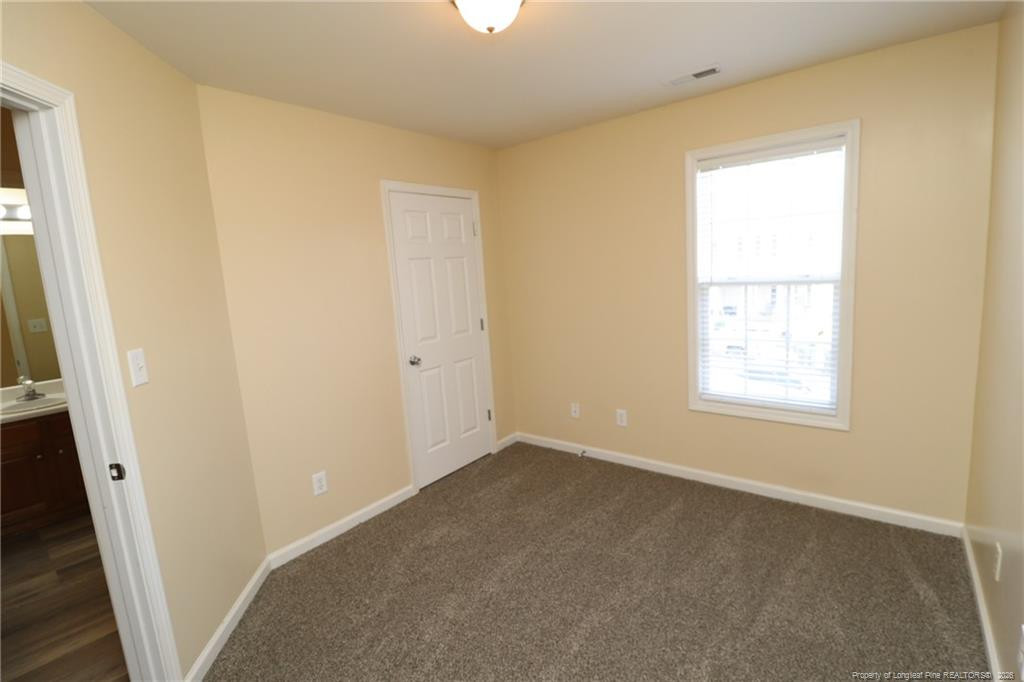 2936 Filbert Street Raleigh, NC 27610 - Photo 20 of 27 a view of an empty room with a window