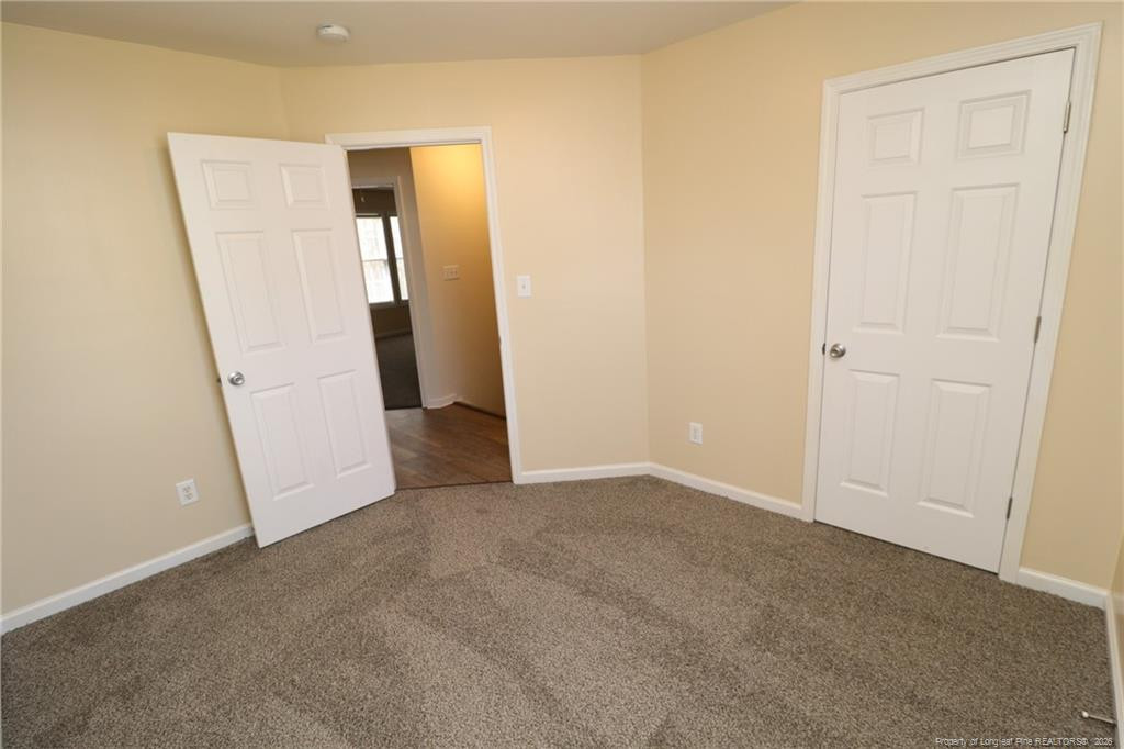 2936 Filbert Street Raleigh, NC 27610 - Photo 21 of 27 an empty room with windows