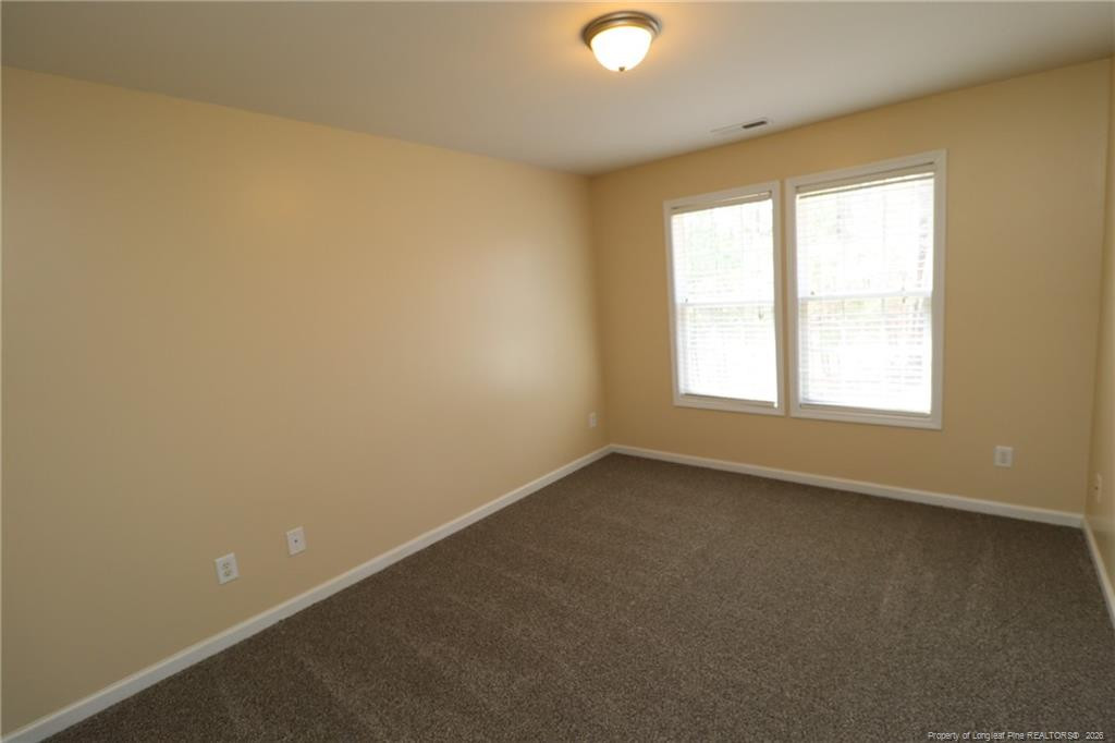 2936 Filbert Street Raleigh, NC 27610 - Photo 23 of 27 an empty room with a window