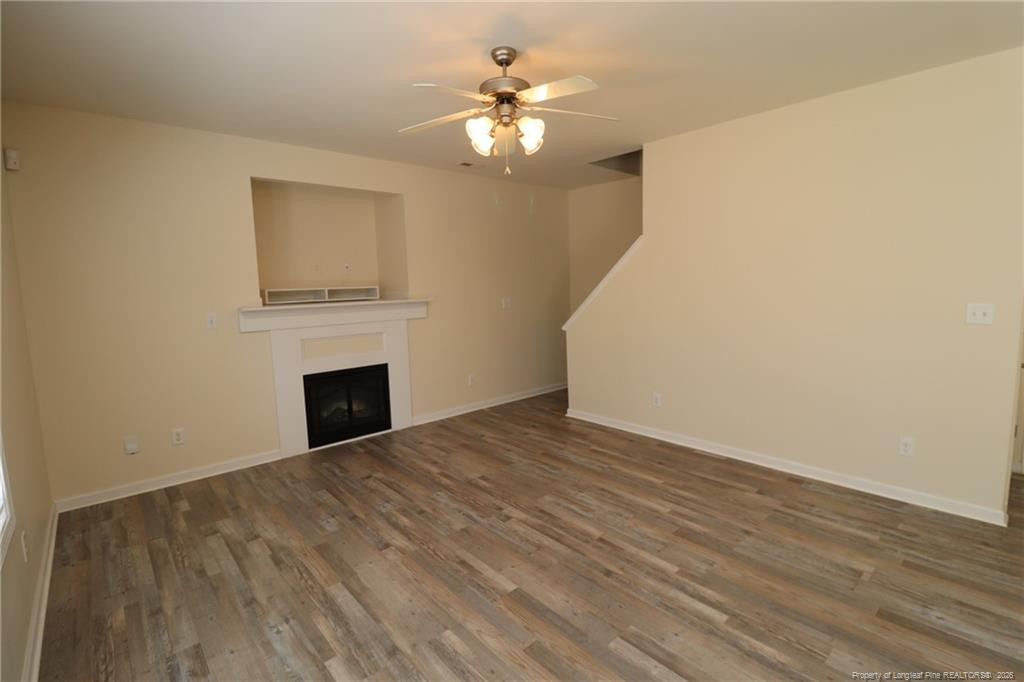 2936 Filbert Street Raleigh, NC 27610 - Photo 7 of 27 a view of empty room with fireplace