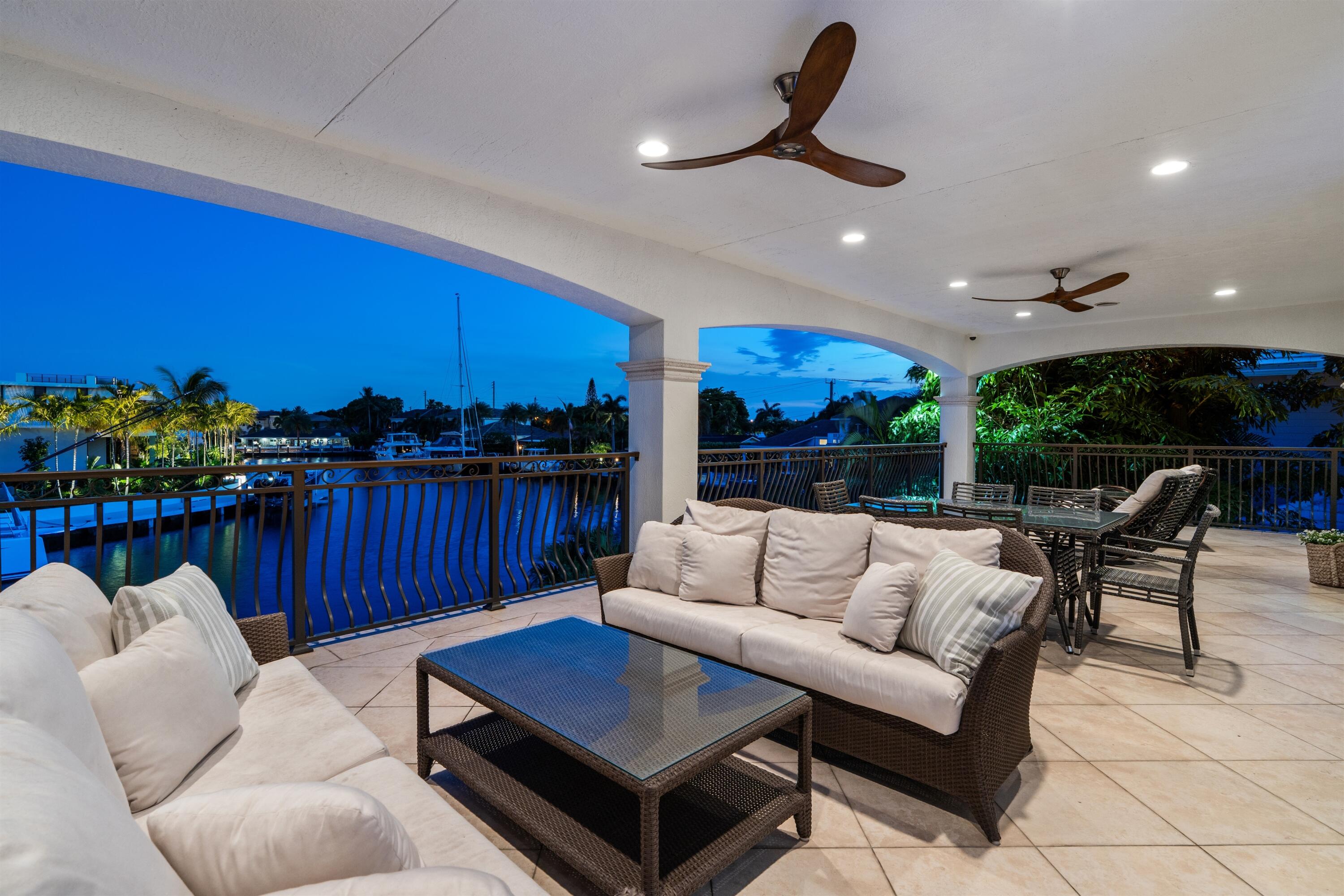 2320 Northeast 34th Court Lighthouse Point, FL 33064 - Photo 34 of 60 BALCONY_SEATING_ANGLE_RIGHT_SUNSET