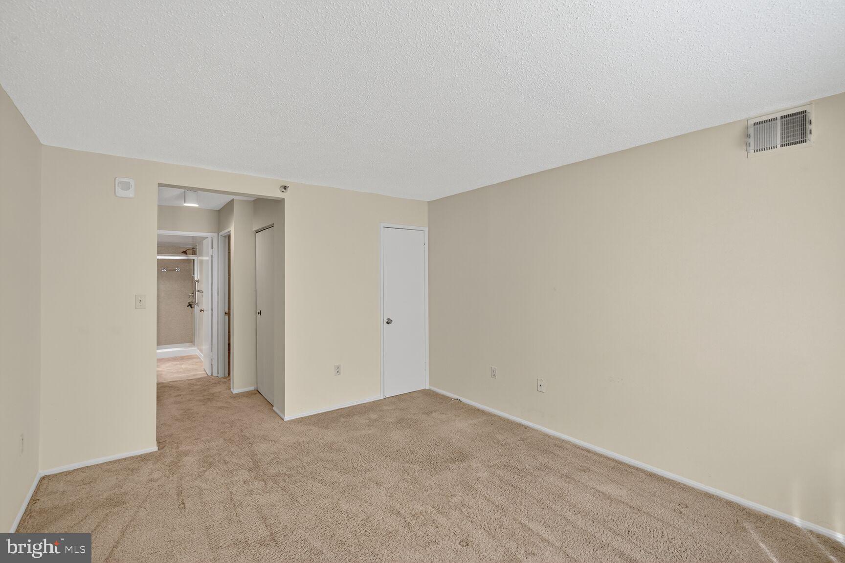 15101 Interlachen Drive, Unit 1123 Silver Spring, MD 20906 - Photo 13 of 29 a view of an empty room and closet area