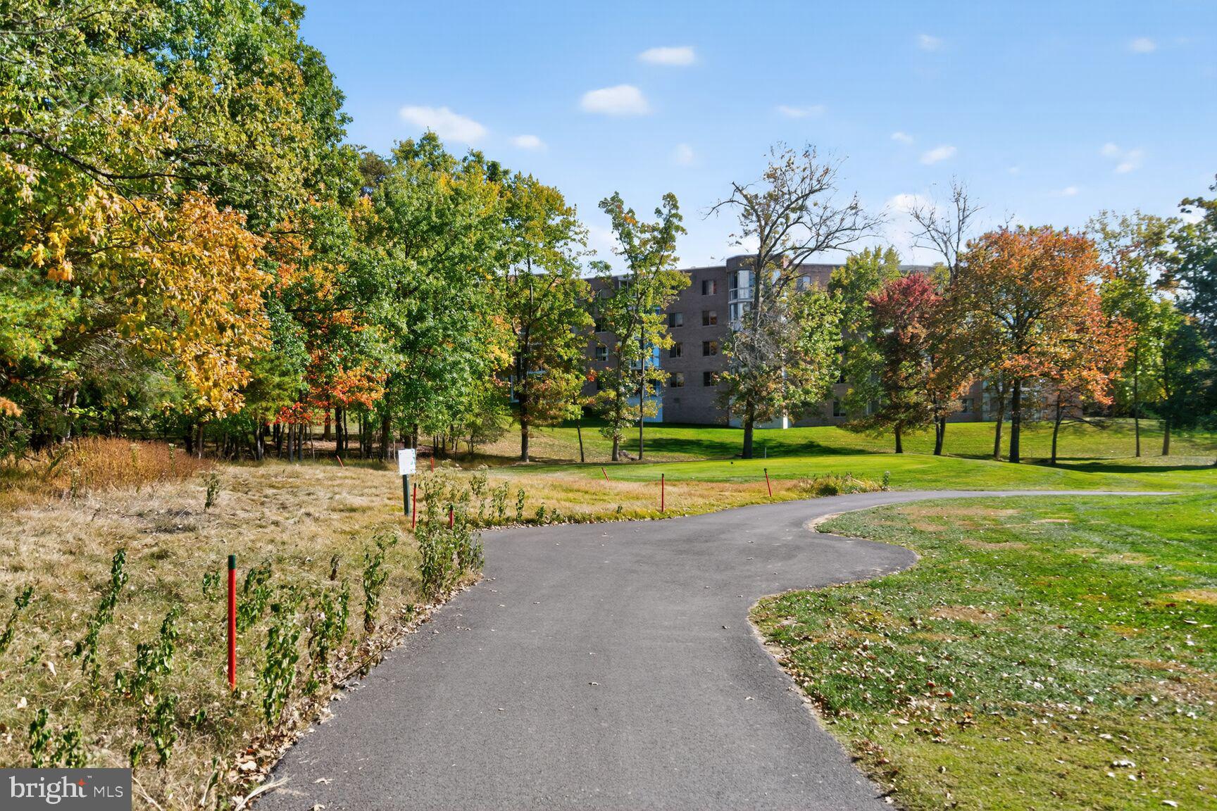 15101 Interlachen Drive, Unit 1123 Silver Spring, MD 20906 - Photo 29 of 29 a view of a golf course with a lake view
