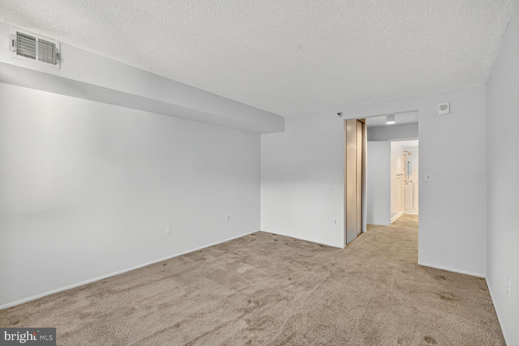 15101 Interlachen Drive, Unit 1123 Silver Spring, MD 20906 - Photo 8 of 29 a view of an empty room