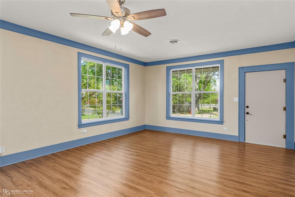 104 3rd Street Northwest Springhill, LA 71075 - Photo 4 of 28 a view of an empty room with wooden floor and a window