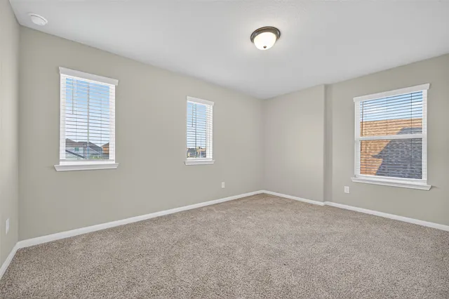 an empty room with closet area