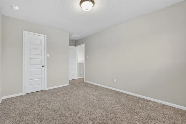 a bathroom with a sink a toilet a mirror a bathtub and shower