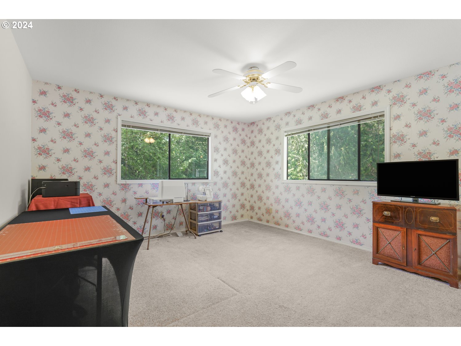 295 McAdams Road East Longview, WA 98632 - Photo 15 of 34 a living room with furniture a flat screen tv and a large window