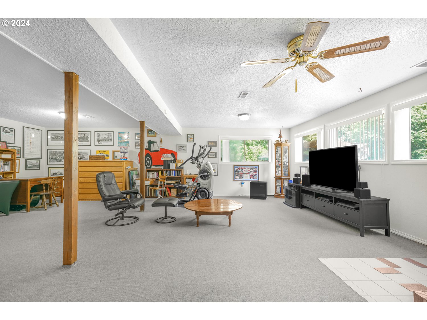 295 McAdams Road East Longview, WA 98632 - Photo 17 of 34 a living room with furniture and a flat screen tv