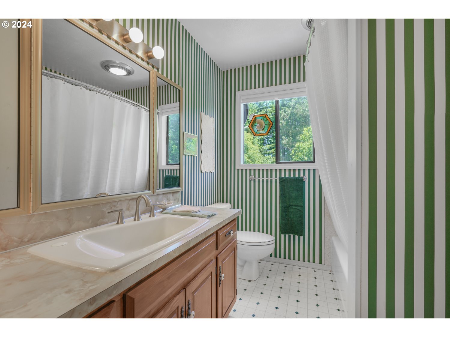 295 McAdams Road East Longview, WA 98632 - Photo 20 of 34 a bathroom with a sink a mirror and a shower