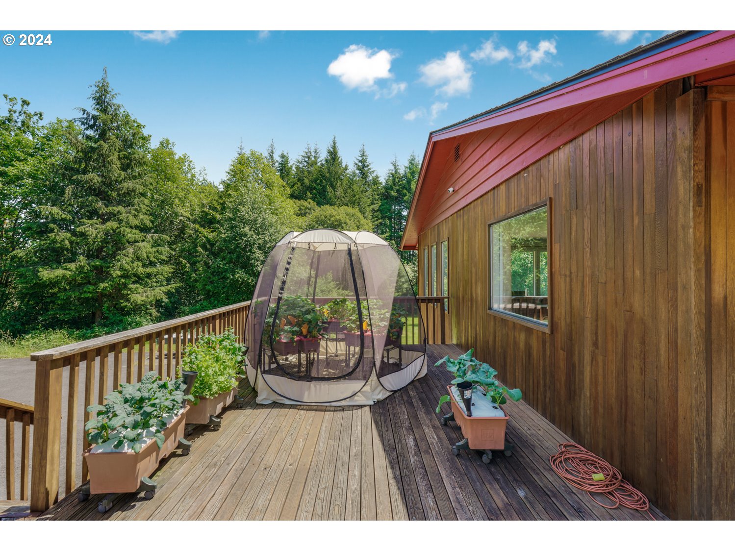 295 McAdams Road East Longview, WA 98632 - Photo 22 of 34 a balcony with wooden floor and outdoor seating