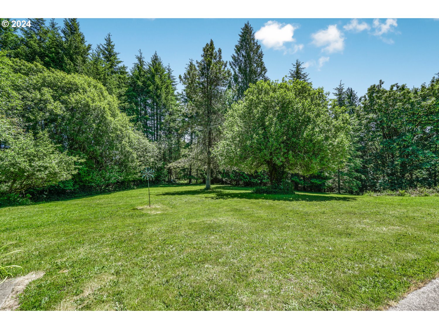295 McAdams Road East Longview, WA 98632 - Photo 30 of 34 a view of a field of grass and trees
