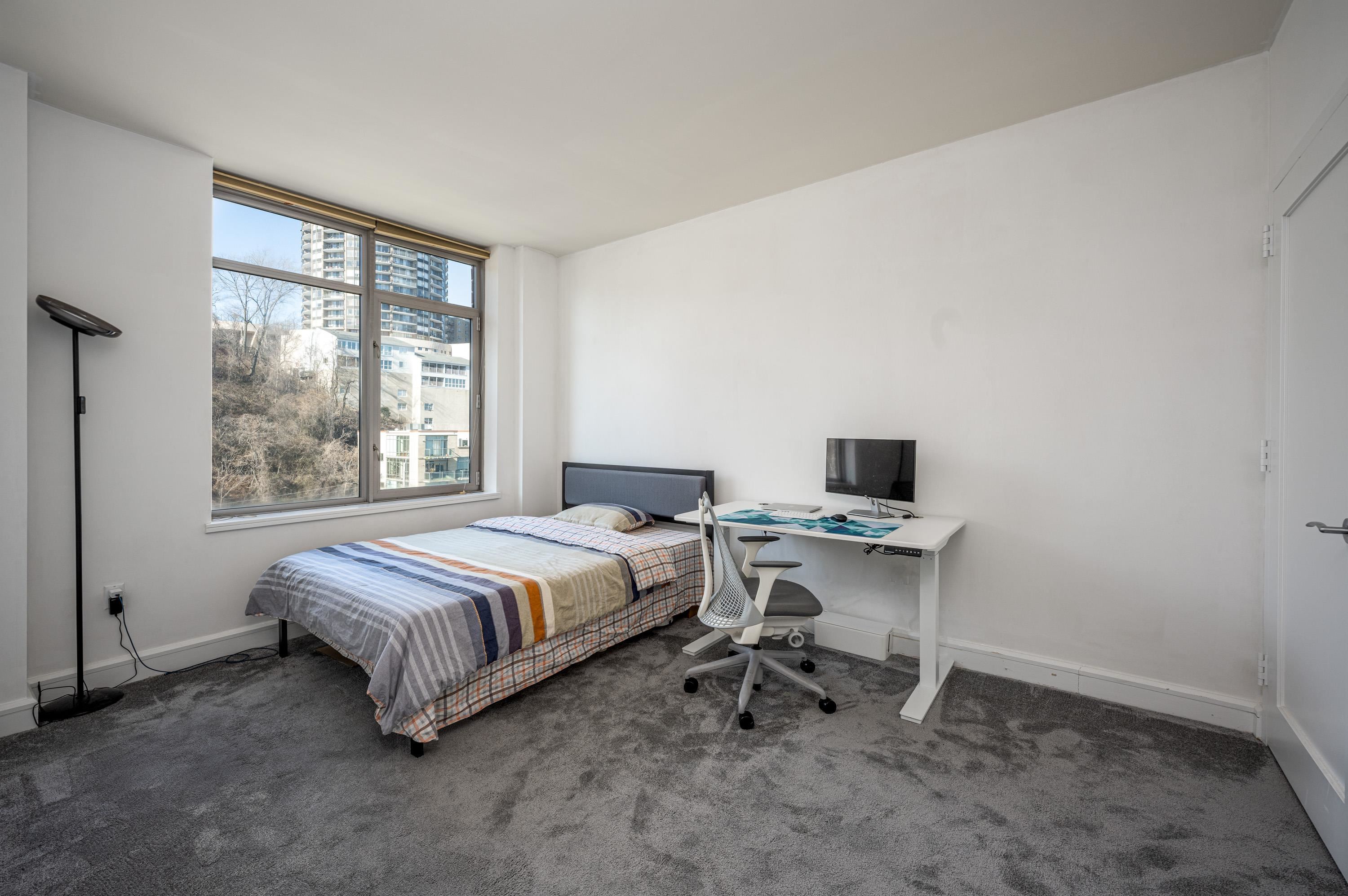 8100 River Road, Unit 810 North Bergen, NJ 07047 - Photo 3 of 20 a bed room with a bed and a window