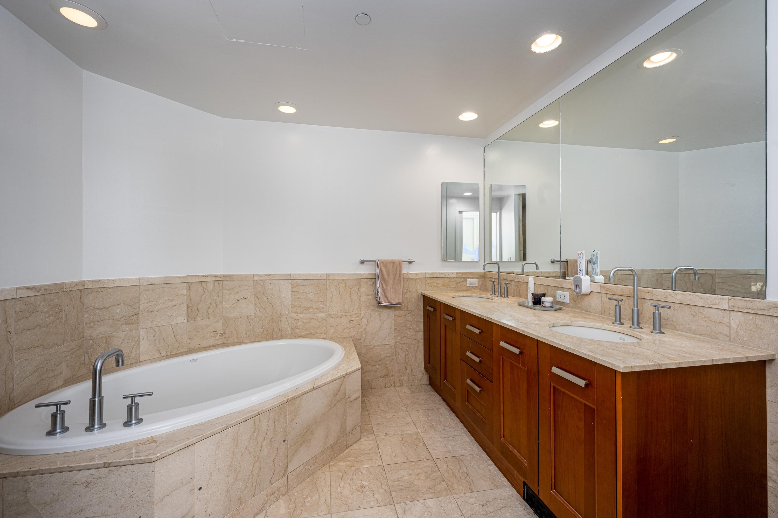 8100 River Road, Unit 810 North Bergen, NJ 07047 - Photo 4 of 20 a bathroom with a double vanity sink and mirror